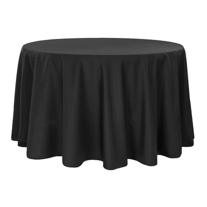Round table covered with a black tablecloth on a white background